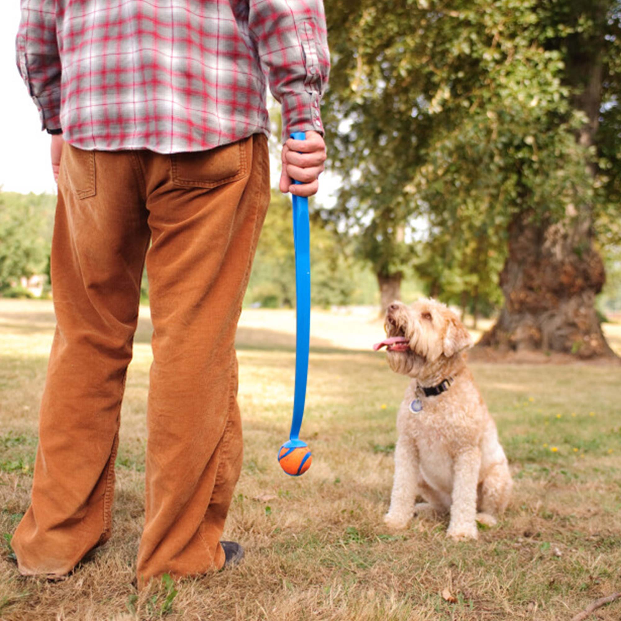 Chuckit! Action Set S by ZIO - Man and dog playing with Chuckit! Sport Launcher and Chuckit! Ultra Ball.