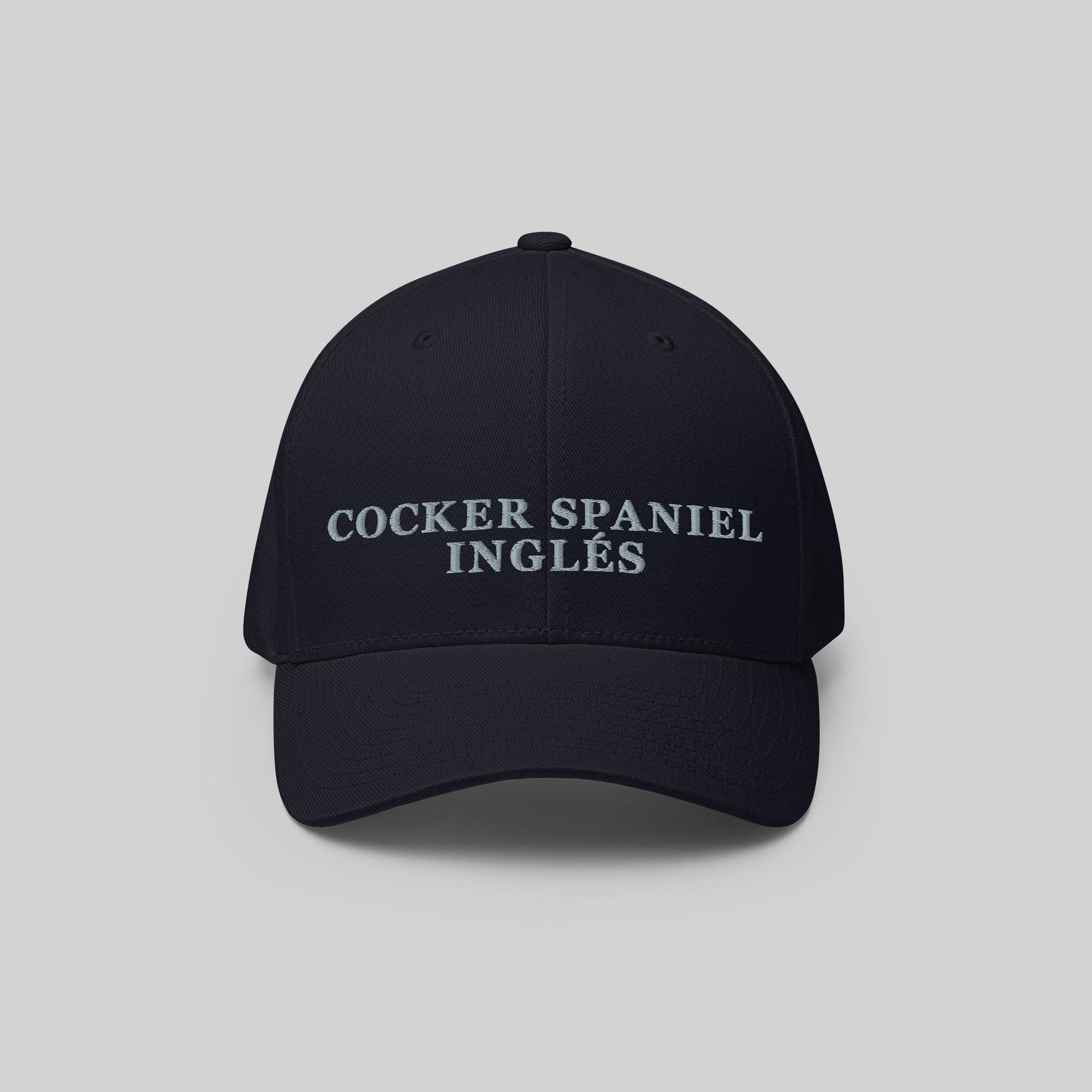 Cocker Spaniel Inglés Cap by ZIO in blue (dark navy). Dog breed “Cocker Spaniel Inglés" embroidered.