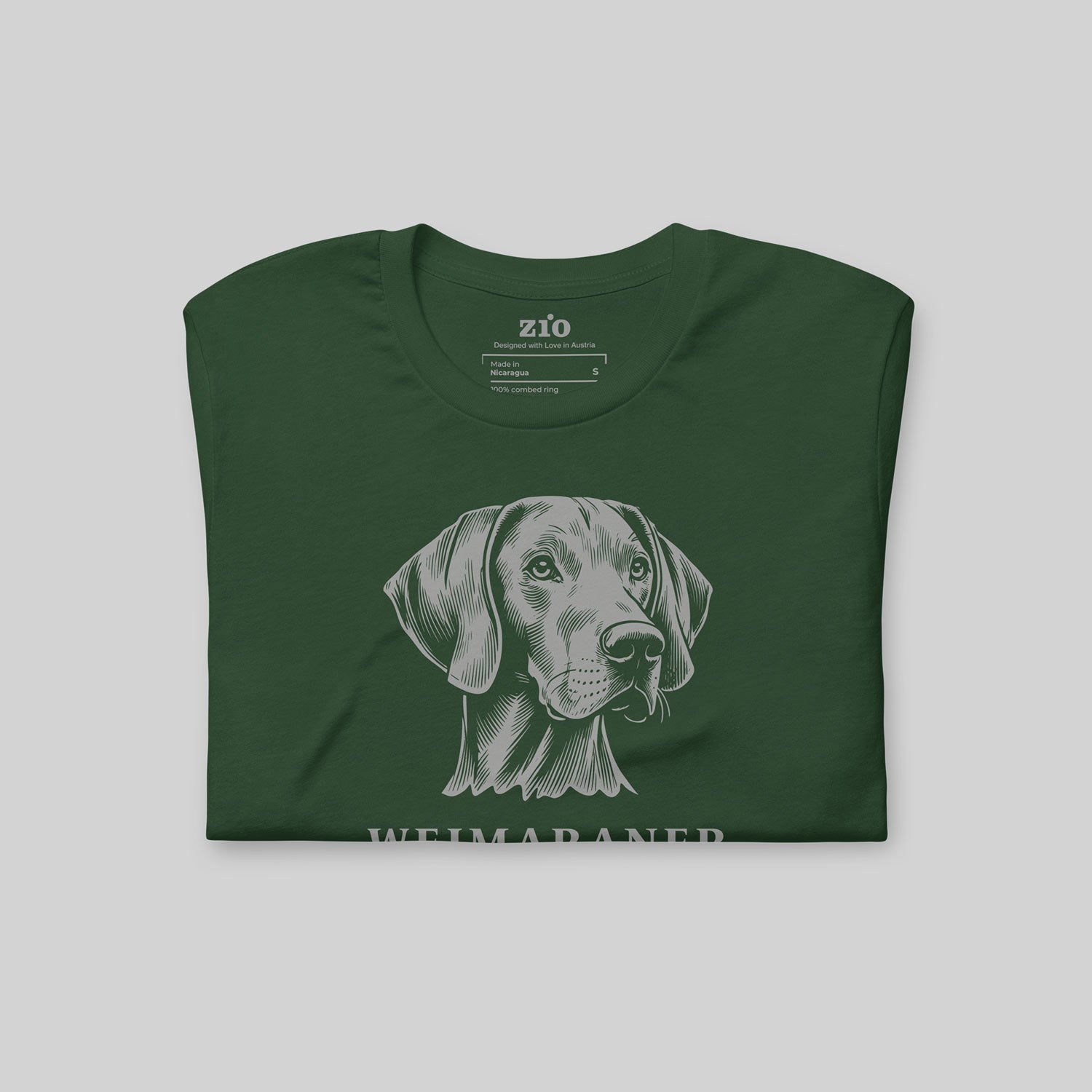 Green ZIO T-shirt with hand-drawn Weimaraner illustration folded